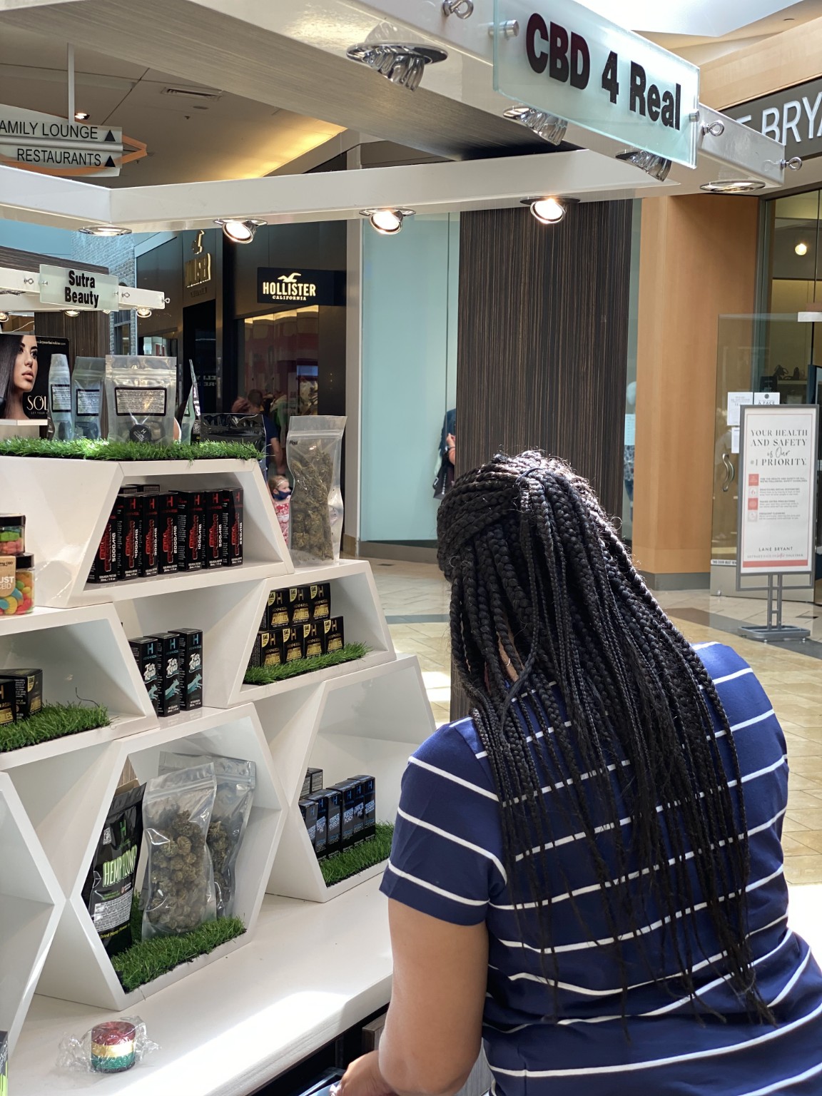 Michelle Pounds working late at their Franklin Park Mall kiosk in Toledo, Ohio.