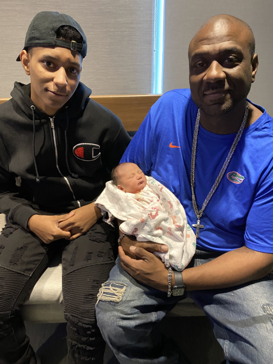 Terrence L Pounds sharing a family moment with a new arrival.