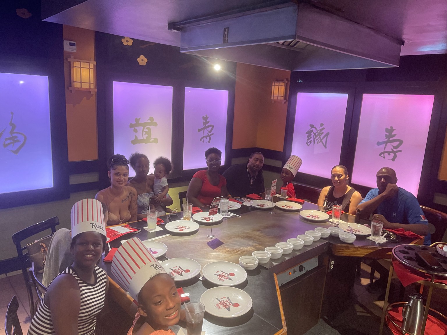 Family dining at Kobé Japanese Steakhouse in Kissimmee, Florida.