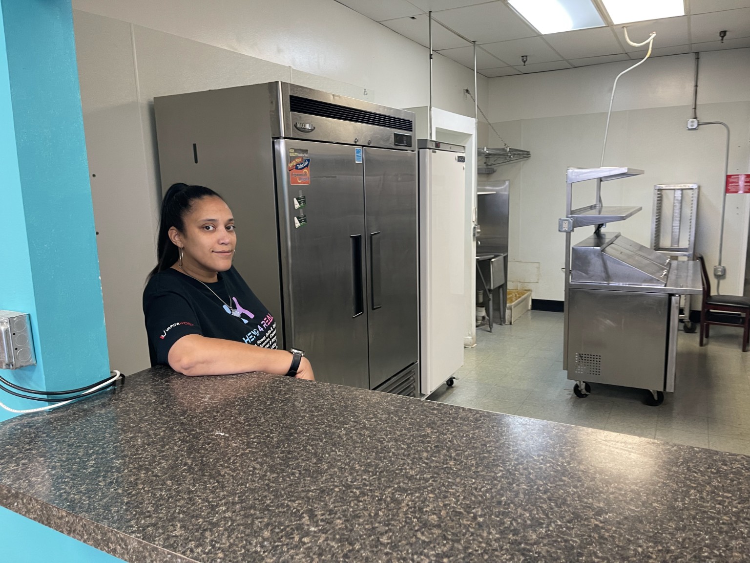 Michelle Pounds in a kitchen setting—part of their shared business, food, and service story.