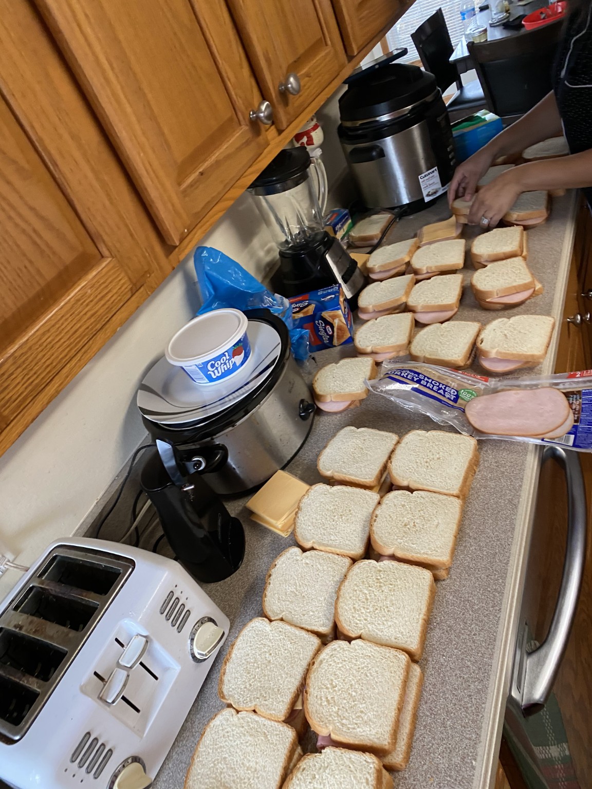 Preparing sandwiches and food bags for people in need.