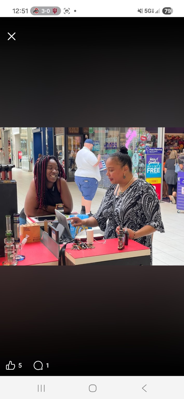 Our great friend Cynthia and our second-oldest daughter, Raniece, working at our CBD 4 REAL kiosk.